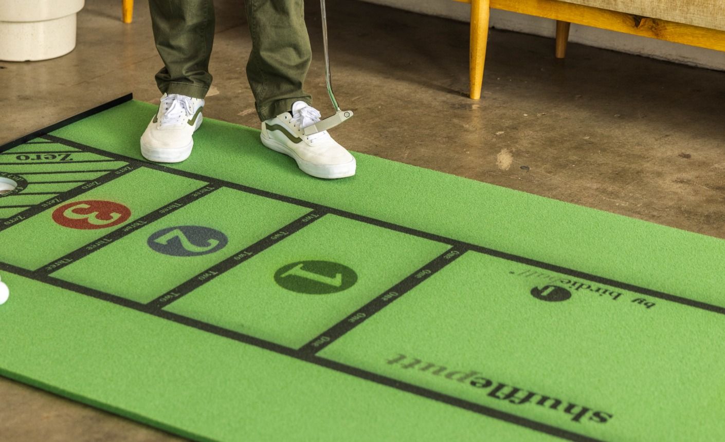 Home putting practice setup with three stations